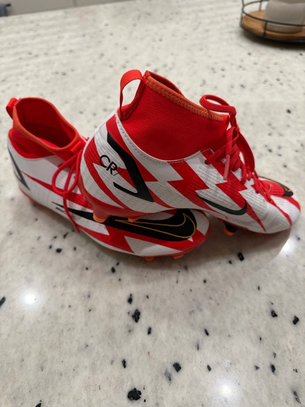Nike Mercurial Superfly Elite FG CR7 outdoor kids cleats in color chile red.